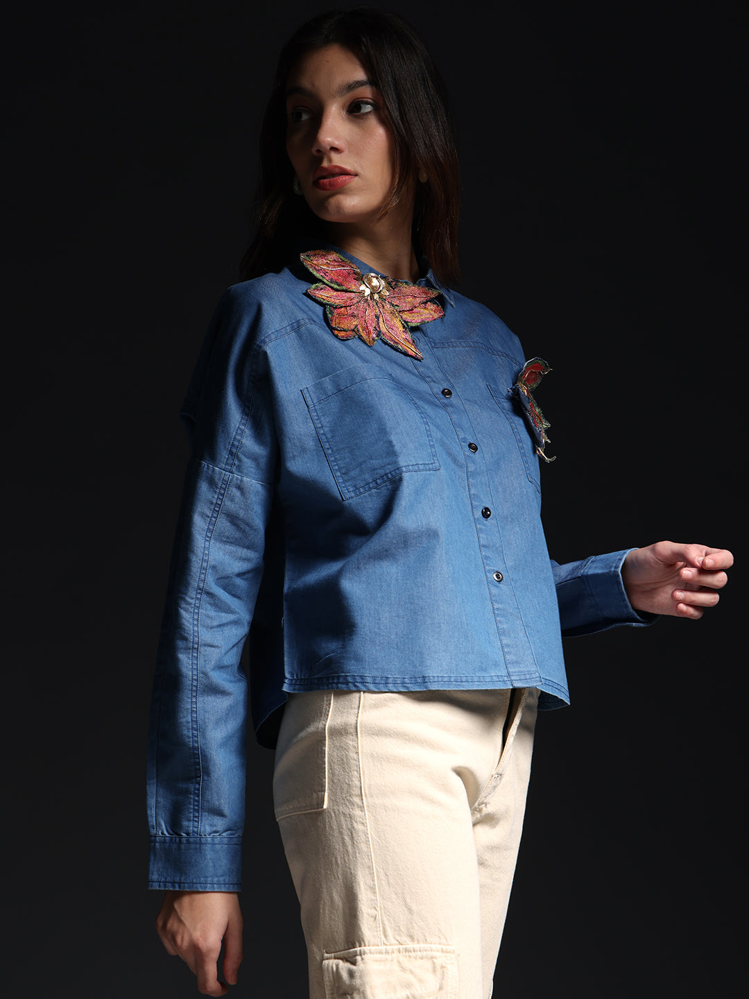 Gotamoda autumn petals shirt in blue denim with floral embroidery worn by female model