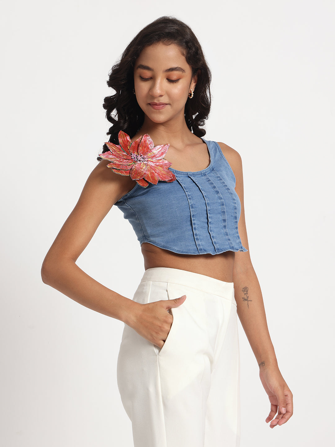 Gotamoda stylish blue jeans top with floral applique worn by woman with white pants