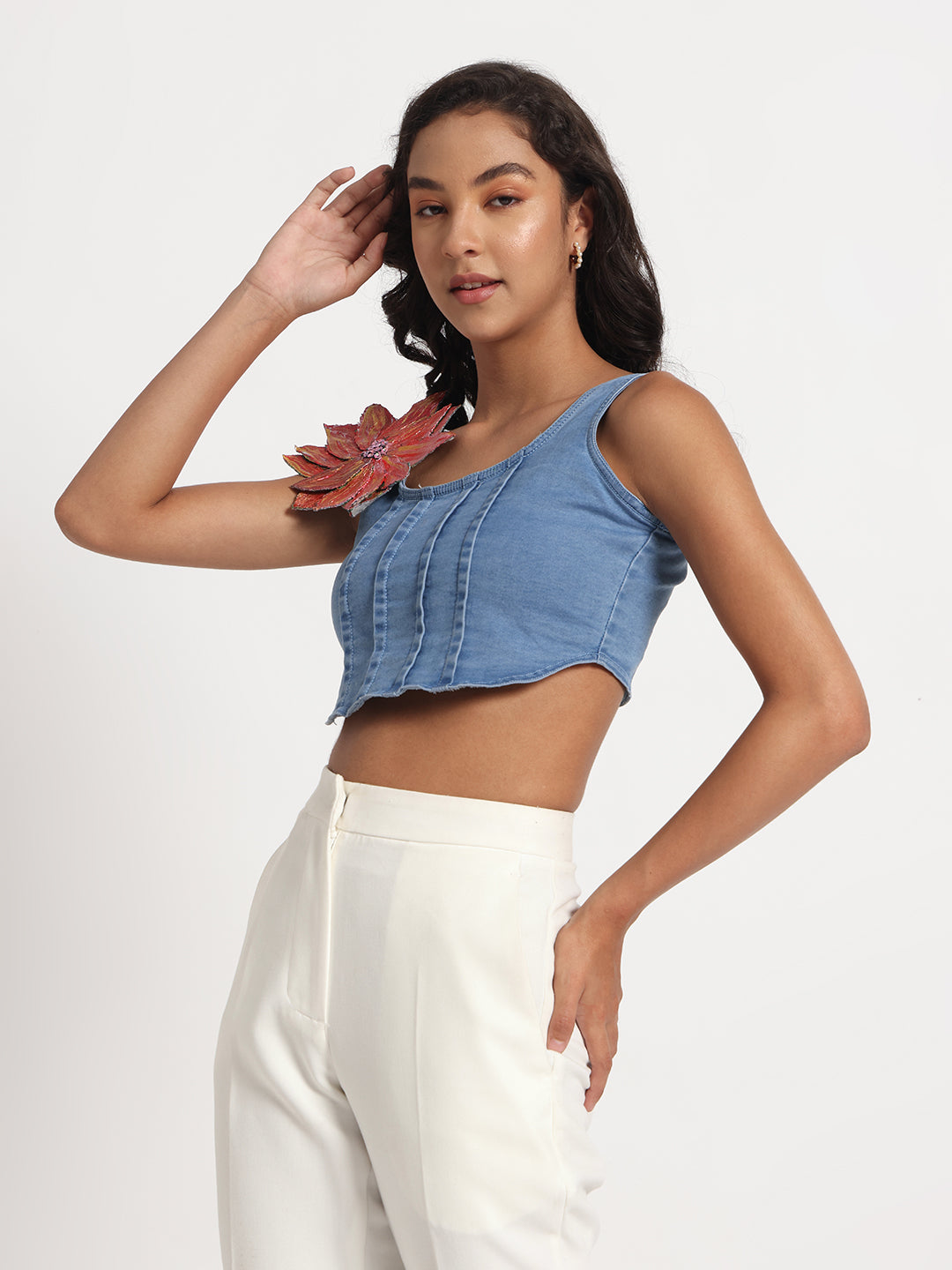 Gotamoda blue sleeveless crop Jeans Top with ruffle detailing paired with white high-waisted pants