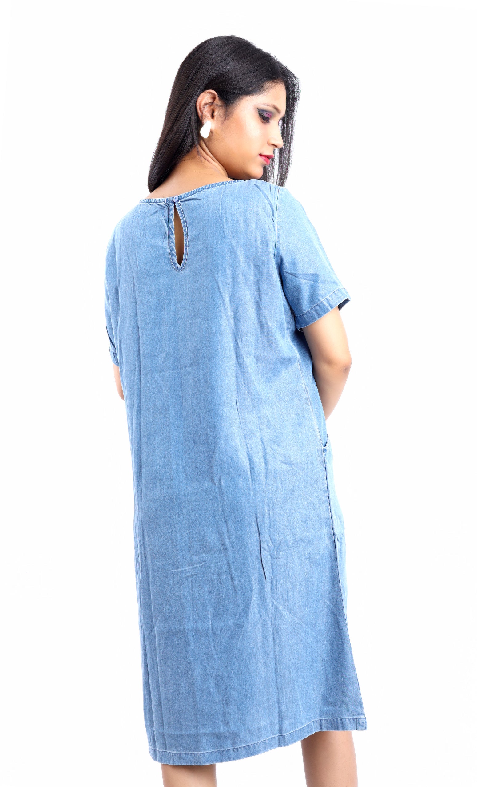 Gotamoda blue denim midi dress worn with jeans showing back keyhole detail