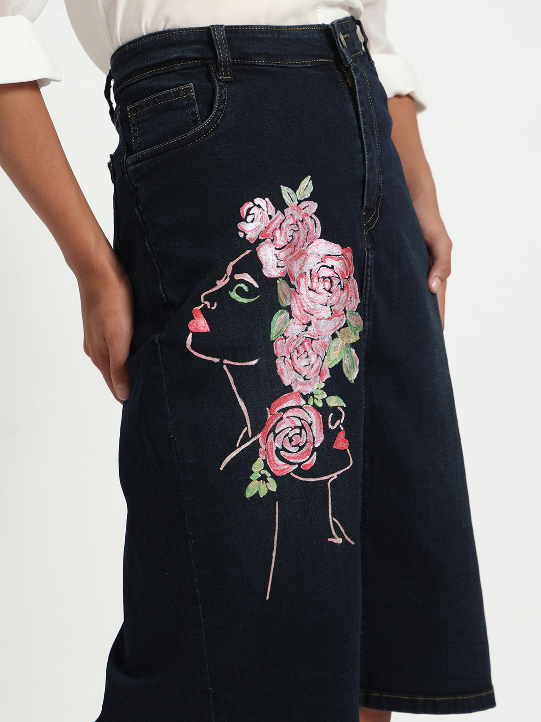 Gotamoda dark blue denim skirt featuring artistic floral face embroidery on the side