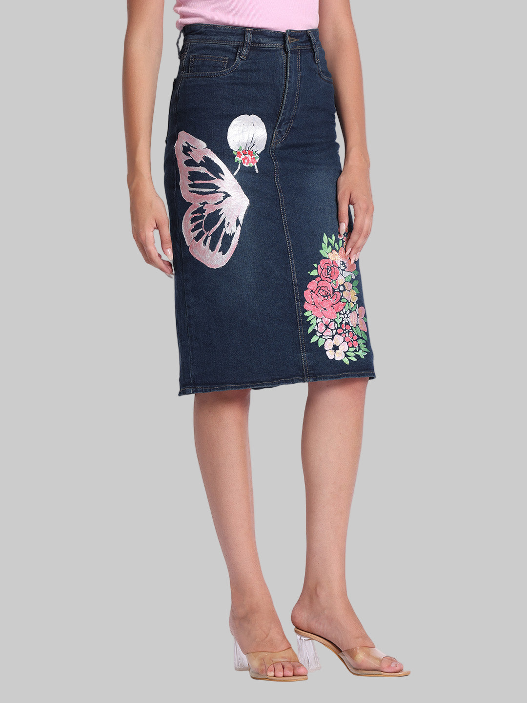 Gotamoda dark blue denim skirt with butterfly and floral embroidery worn with pink top and clear heels