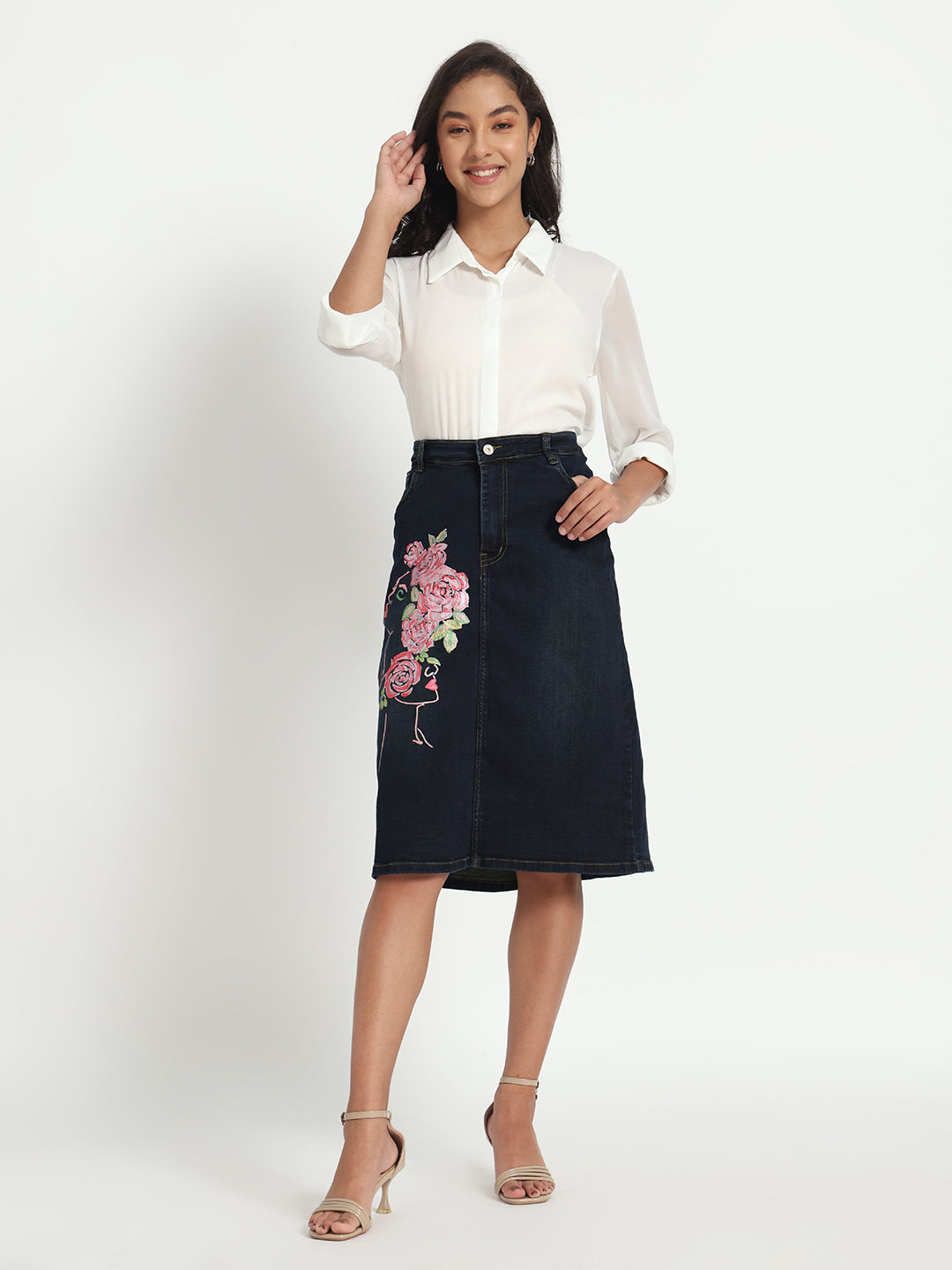Gotamoda dark blue denim skirt with pink floral embroidery worn with white blouse and heels