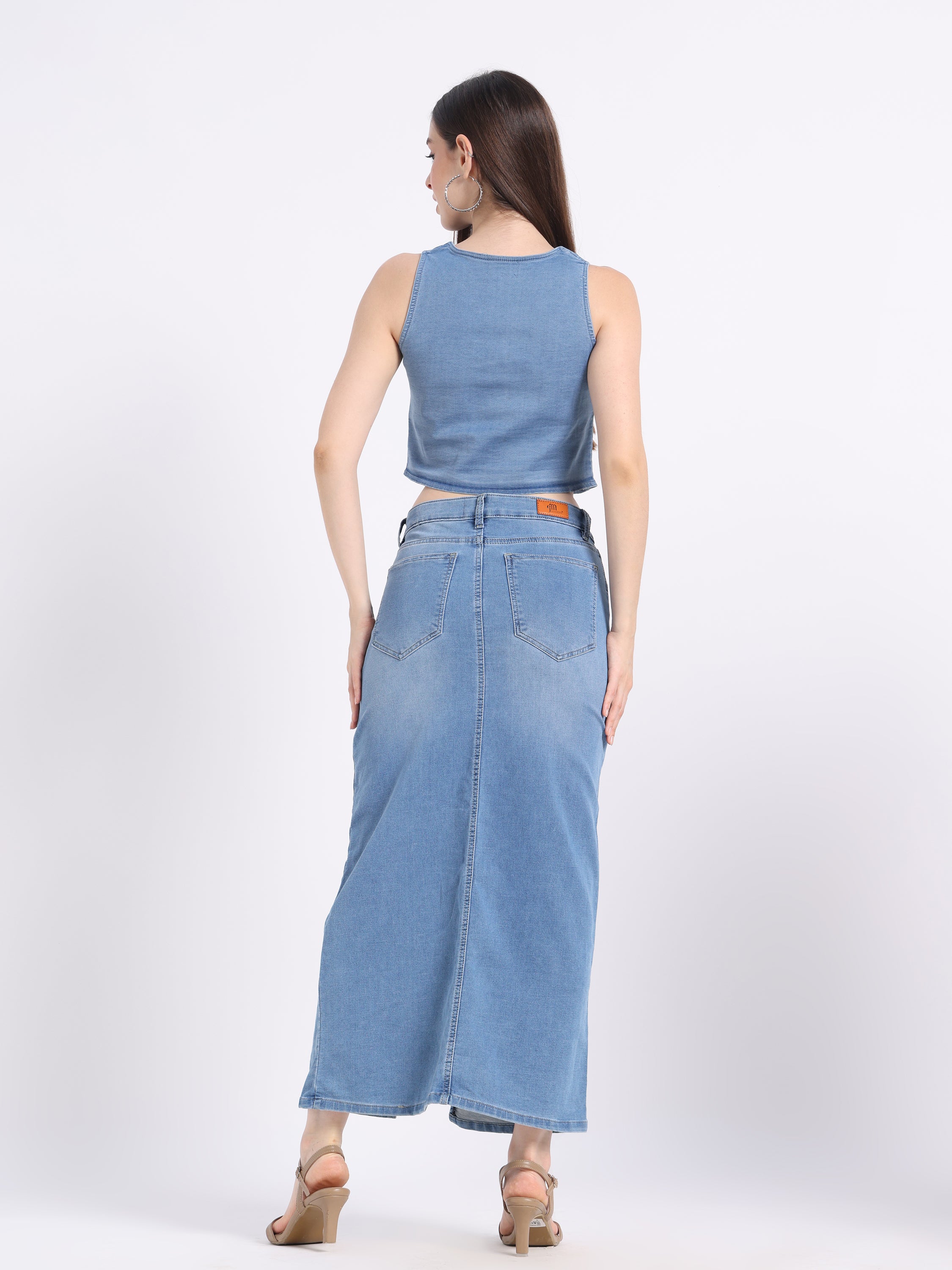 Back view of a hand-painted denim co-ord set featuring a crop top and maxi skirt by gotamoda