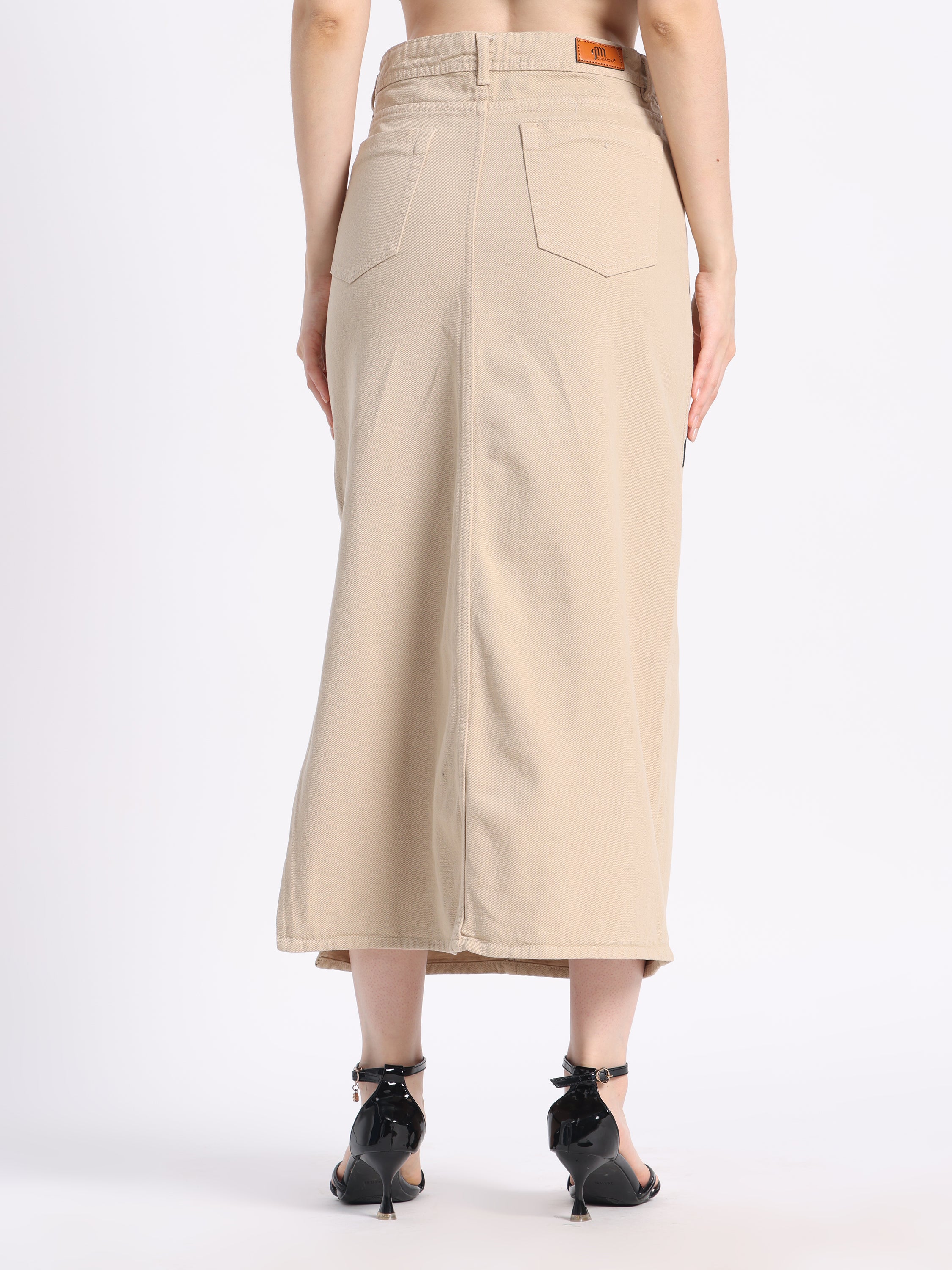 Back view of a gotamoda hand-painted denim skirt, showcasing its minimalist design and tailored fit