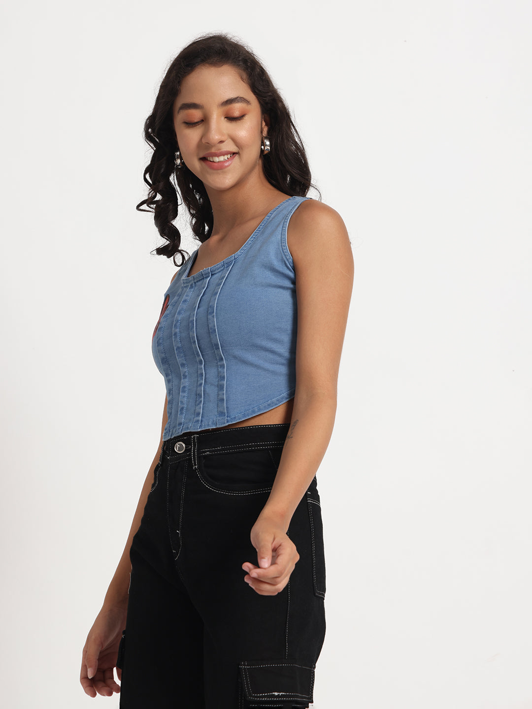 Gotamoda blue sleeveless Jeans Crop Top worn by smiling woman with black pants
