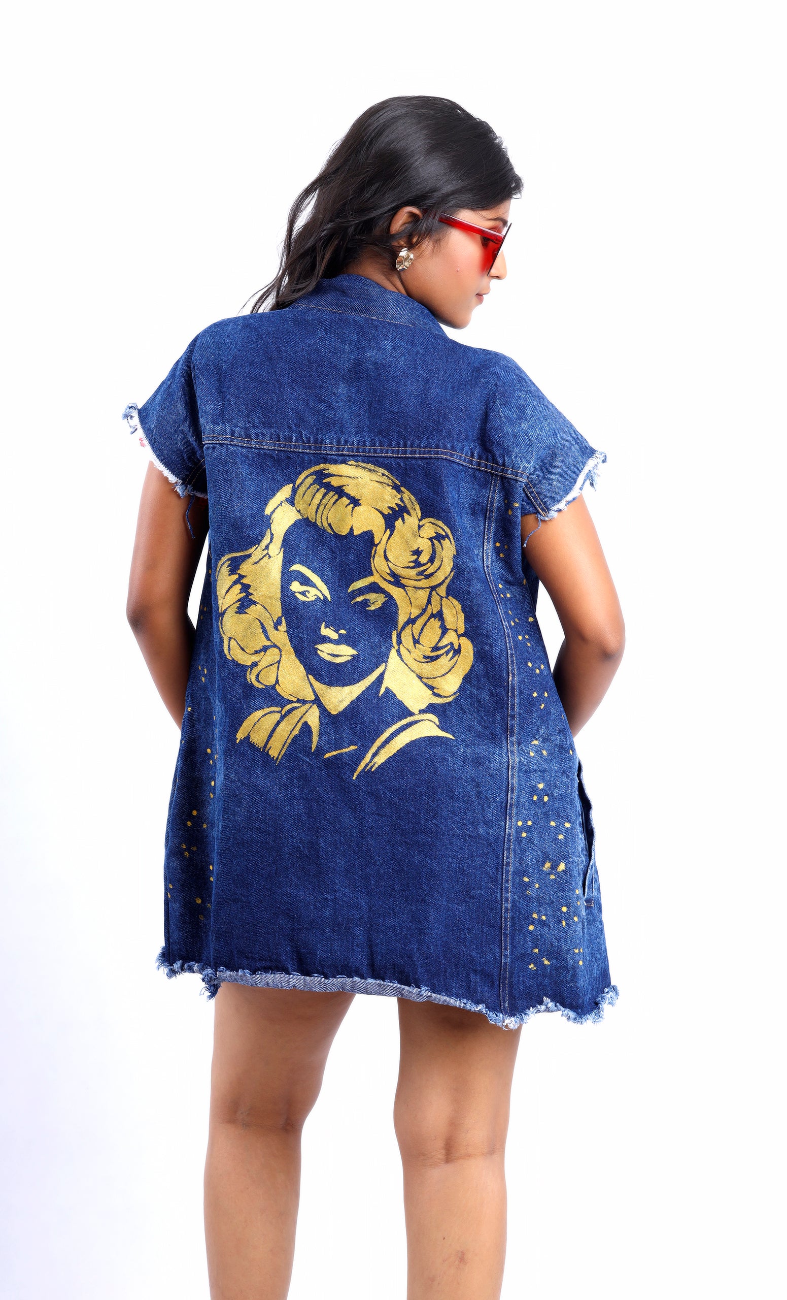Gotamoda sleeveless denim jacket with yellow graphic print on back and distressed hem