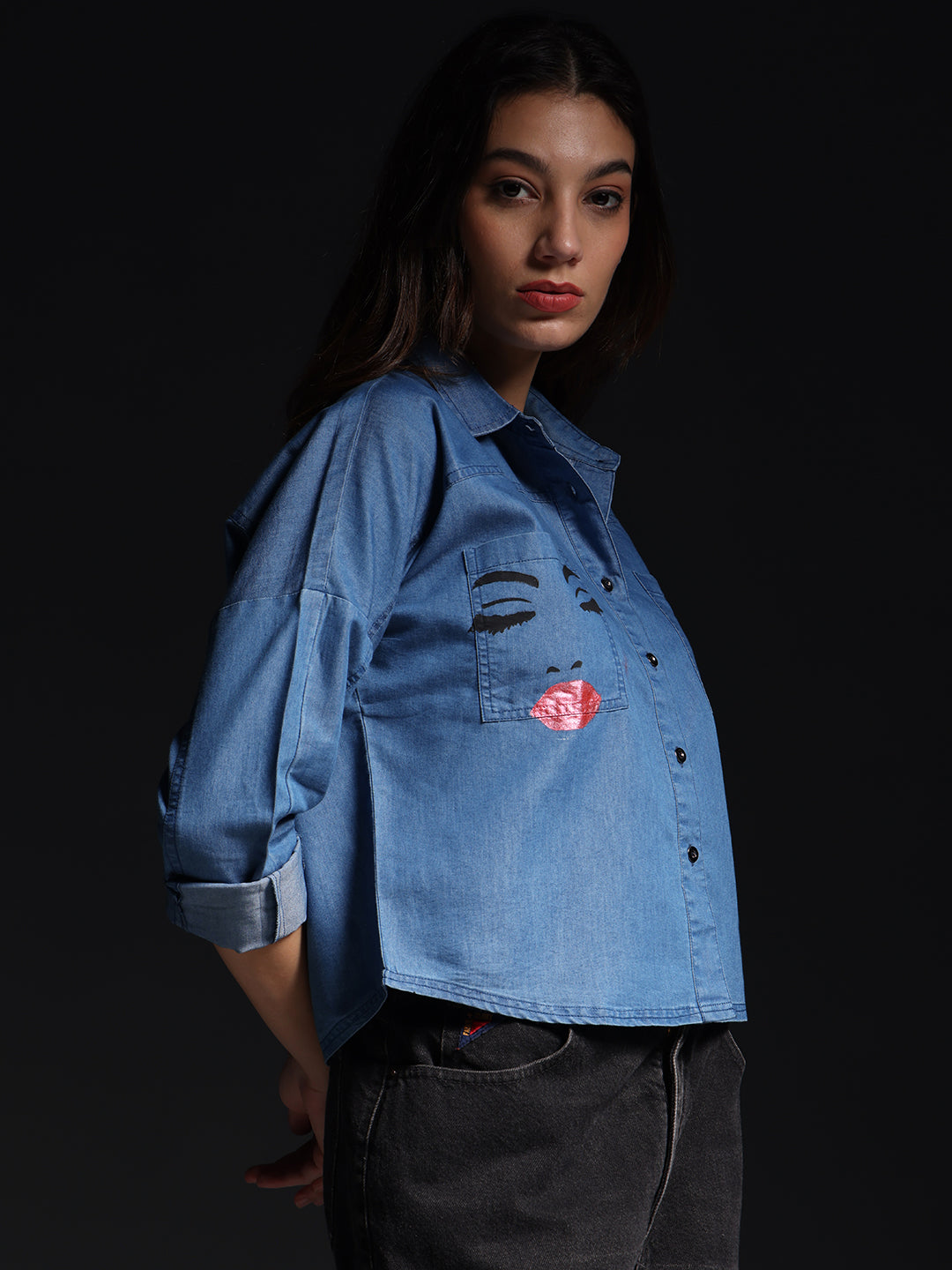 Gotamoda top jeans shirt in light blue denim with rolled sleeves and graphic design worn by model