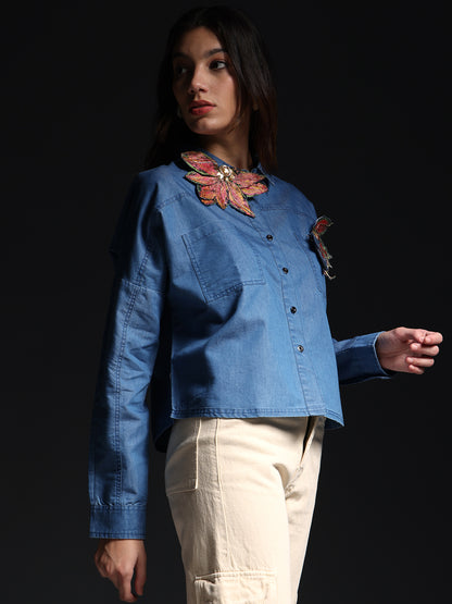 Gotamoda autumn petals shirt in blue denim with floral embroidery worn by female model