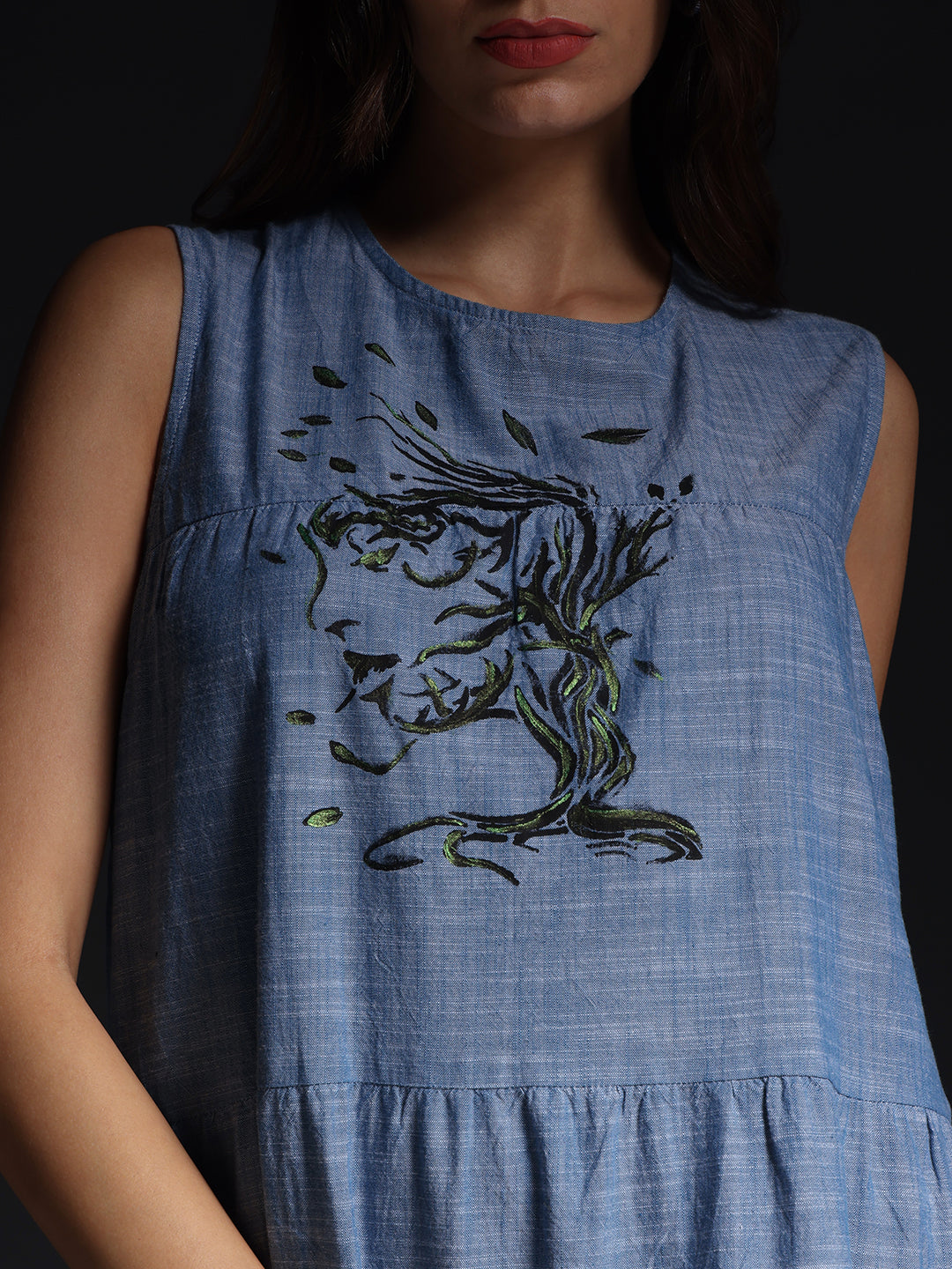 Gotamoda blue sleeveless maxi dress with artistic face and leaf design on chest