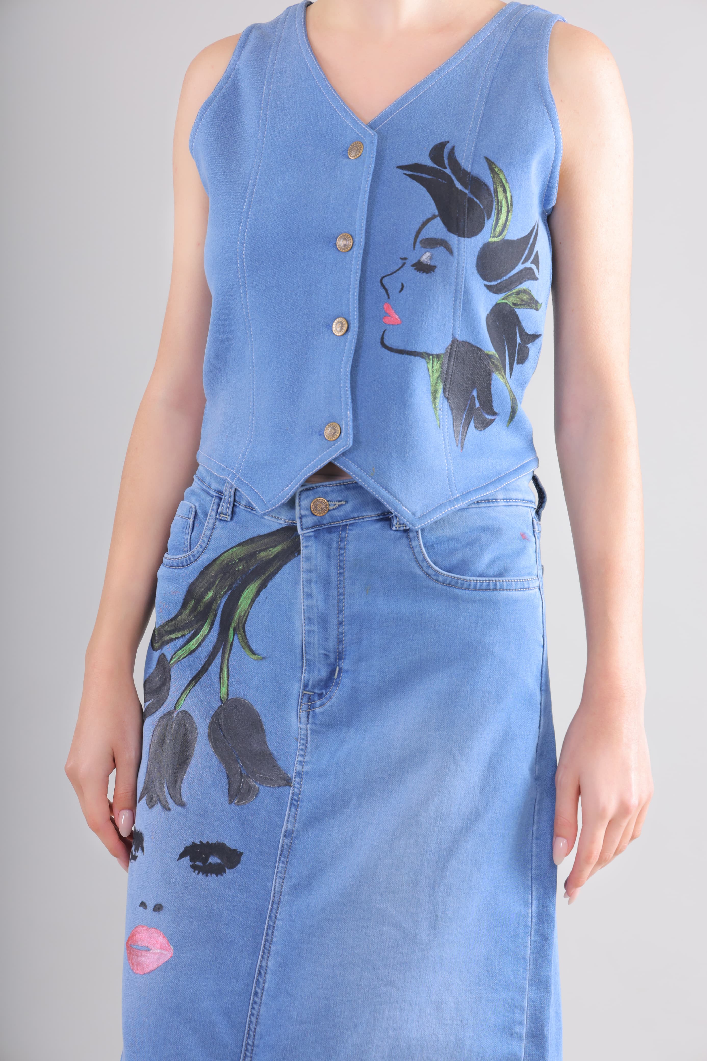 Gotamoda blue denim co ord set women featuring a sleeveless button-up top and matching skirt with artistic face prints