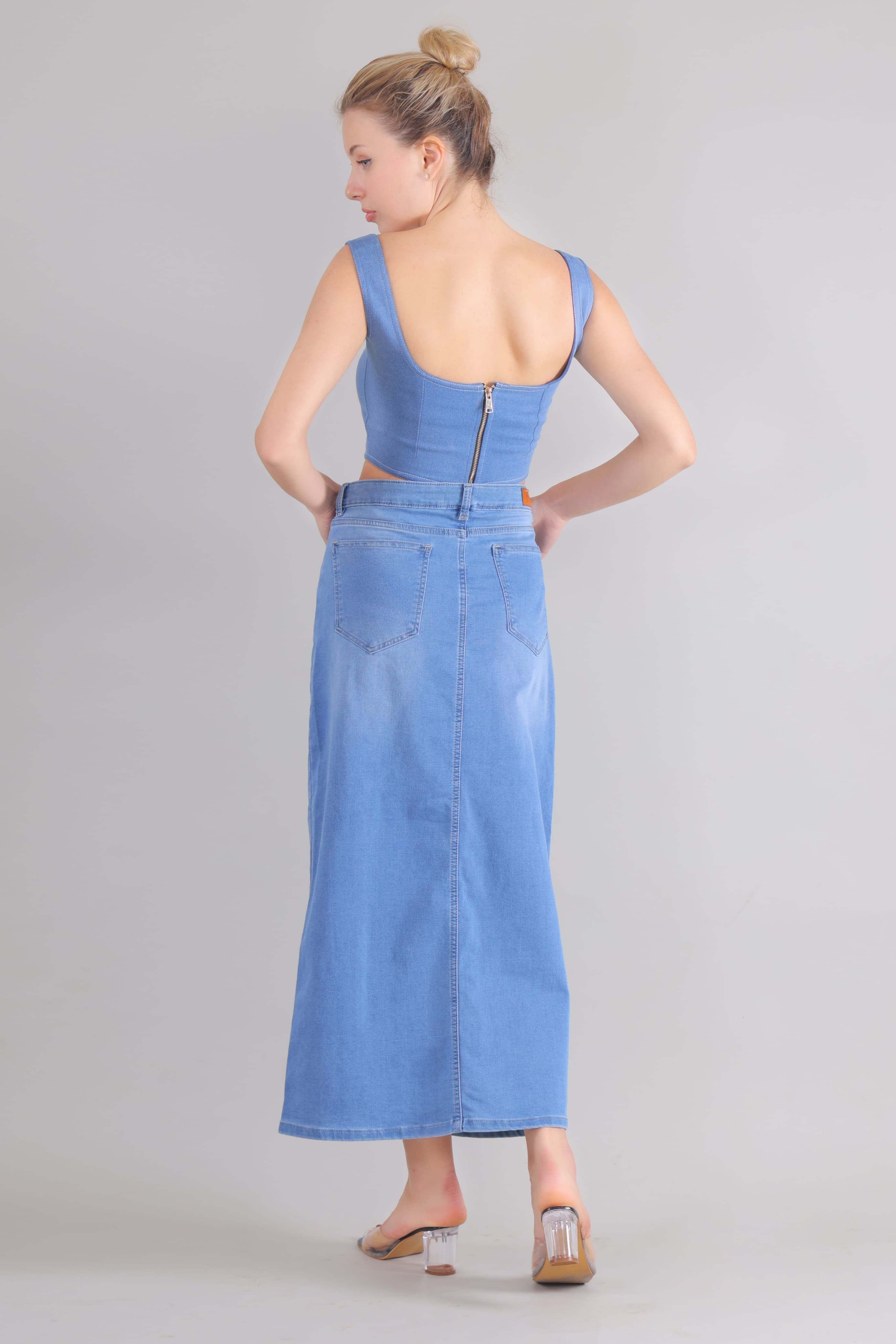 Back view of woman wearing Gotamoda denim corset co-ord set with zipper detail and long skirt