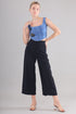 Gotamoda Denim Corset Top in blue with floral embroidery paired with black wide-leg pants