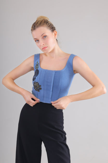 Gotamoda blue Denim Corset Top with floral embroidery worn by woman with black pants
