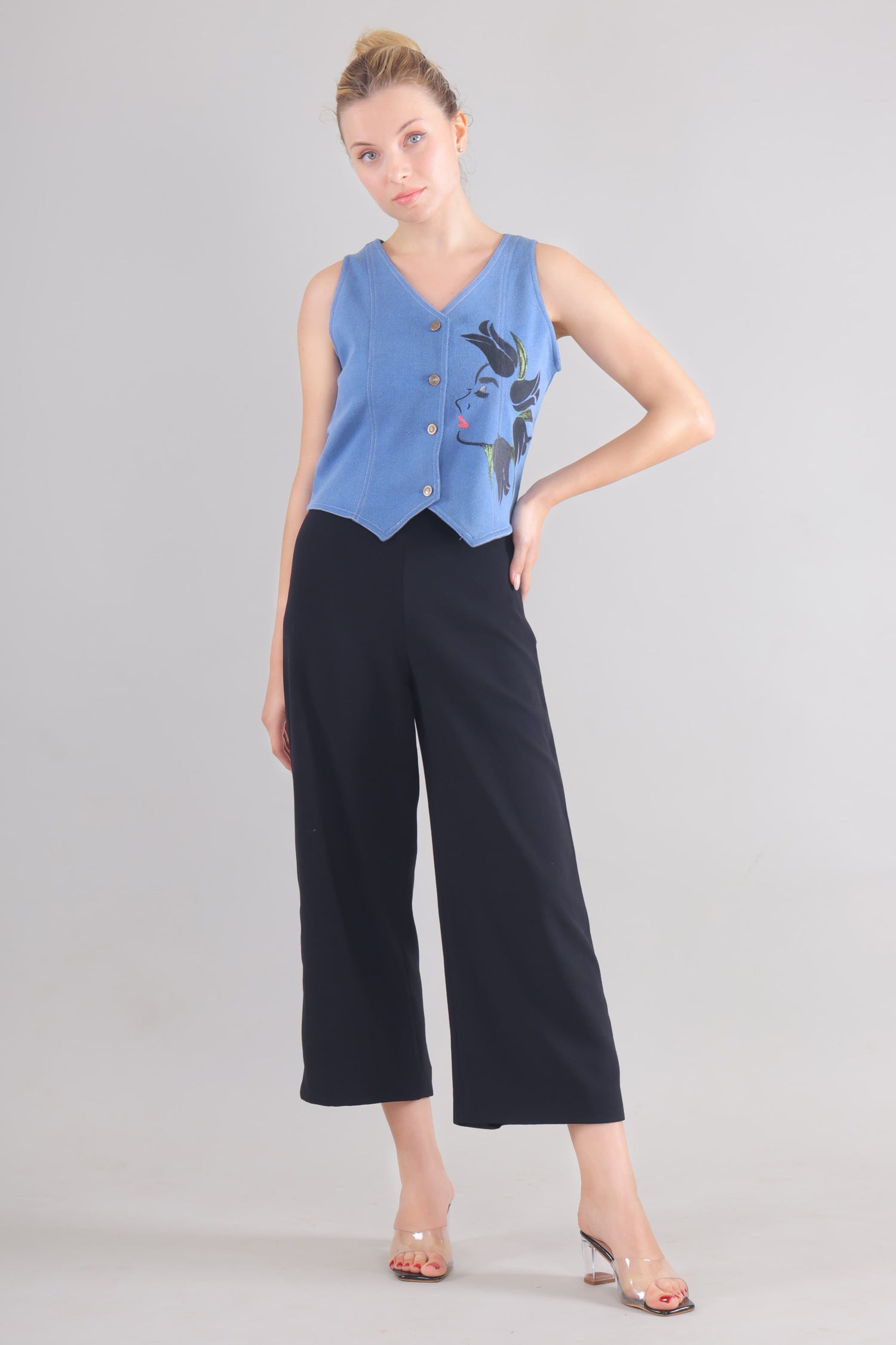 Gotamoda sleeveless blue buttoned top with floral design paired with black wide-leg pants jeans Top