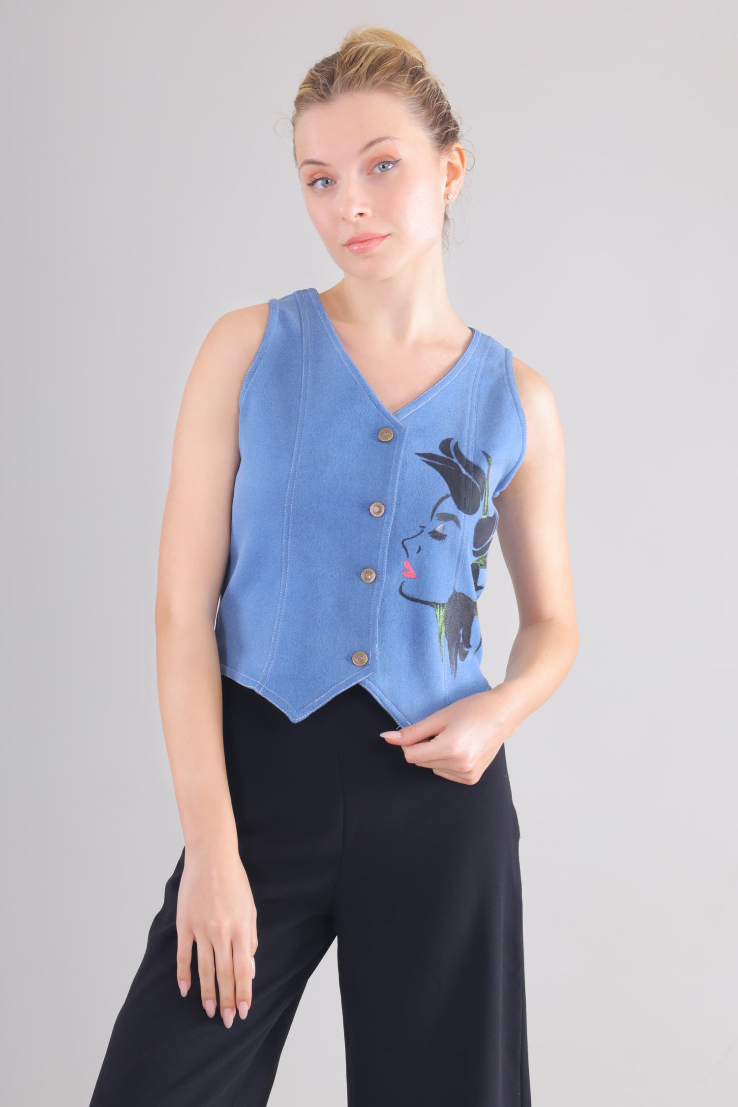 Gotamoda blue sleeveless jeans Top with front buttons and artistic face print on the side
