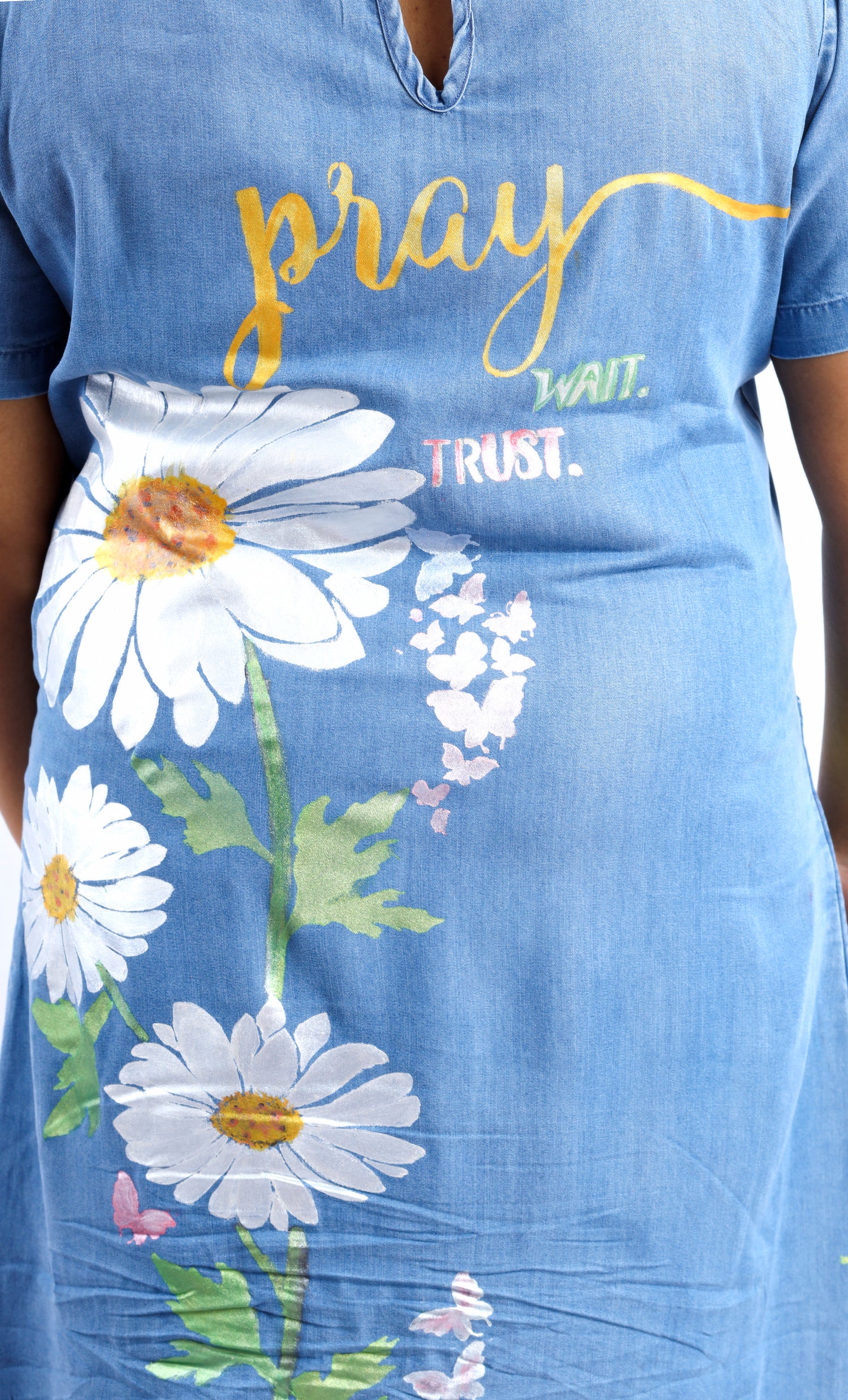 Gotamoda blue midi dress with floral print and motivational text styled with midi with jeans