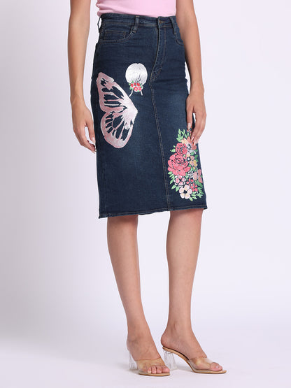 Gotamoda dark blue denim skirt with butterfly and floral embroidery worn with pink top and clear heels