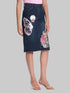 Gotamoda dark blue denim skirt with butterfly and floral embroidery worn with pink top and clear heels