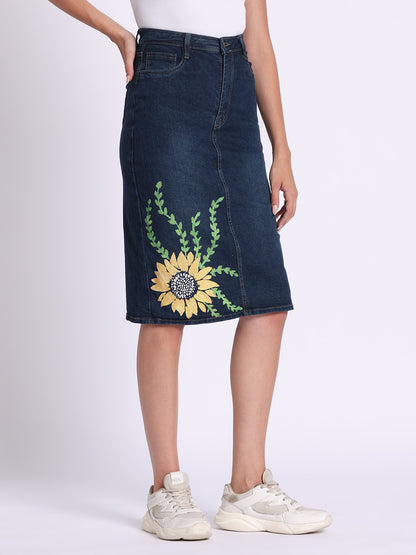 Gotamoda denim skirt with sunflower embroidery and knee-length fit styled with sneakers