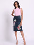 Gotamoda dark blue Denim Skirt with floral and butterfly embroidery worn by woman in pink sleeveless top