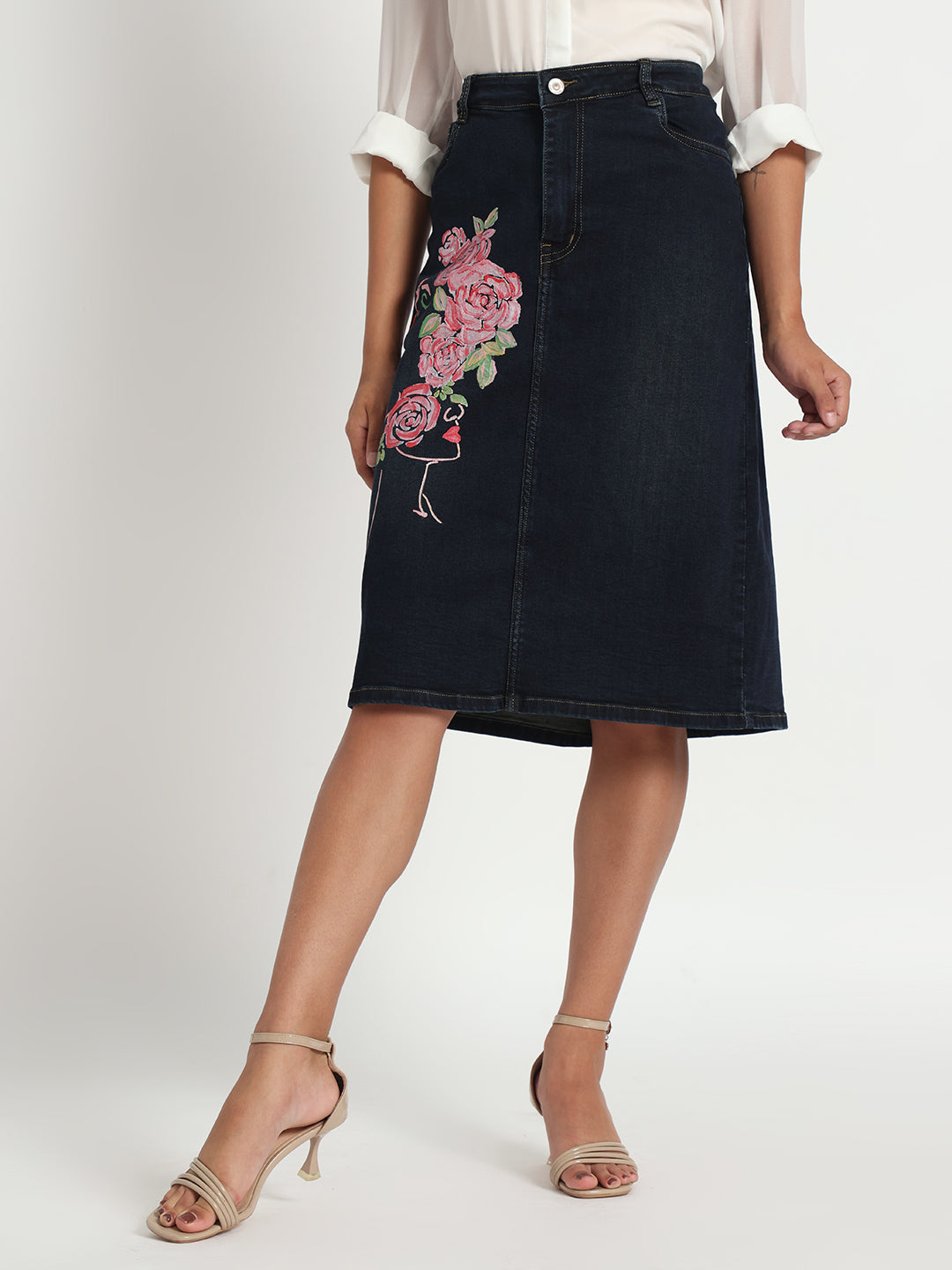 Gotamoda dark blue denim skirt with floral embroidery worn with white blouse and beige heels