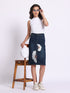 Gotamoda denim skirt with white floral embroidery worn with white sleeveless top and sneakers