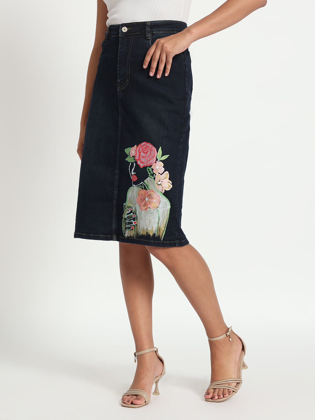Gotamoda hand-painted denim skirt with floral design worn with white top and beige heels