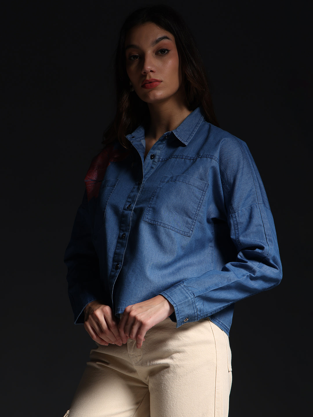 Gotamoda top jeans shirt worn by woman with long sleeves and front pocket in blue denim