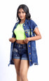 Gotamoda sleeveless denim jacket worn by a woman styled with neon green crop top and denim shorts