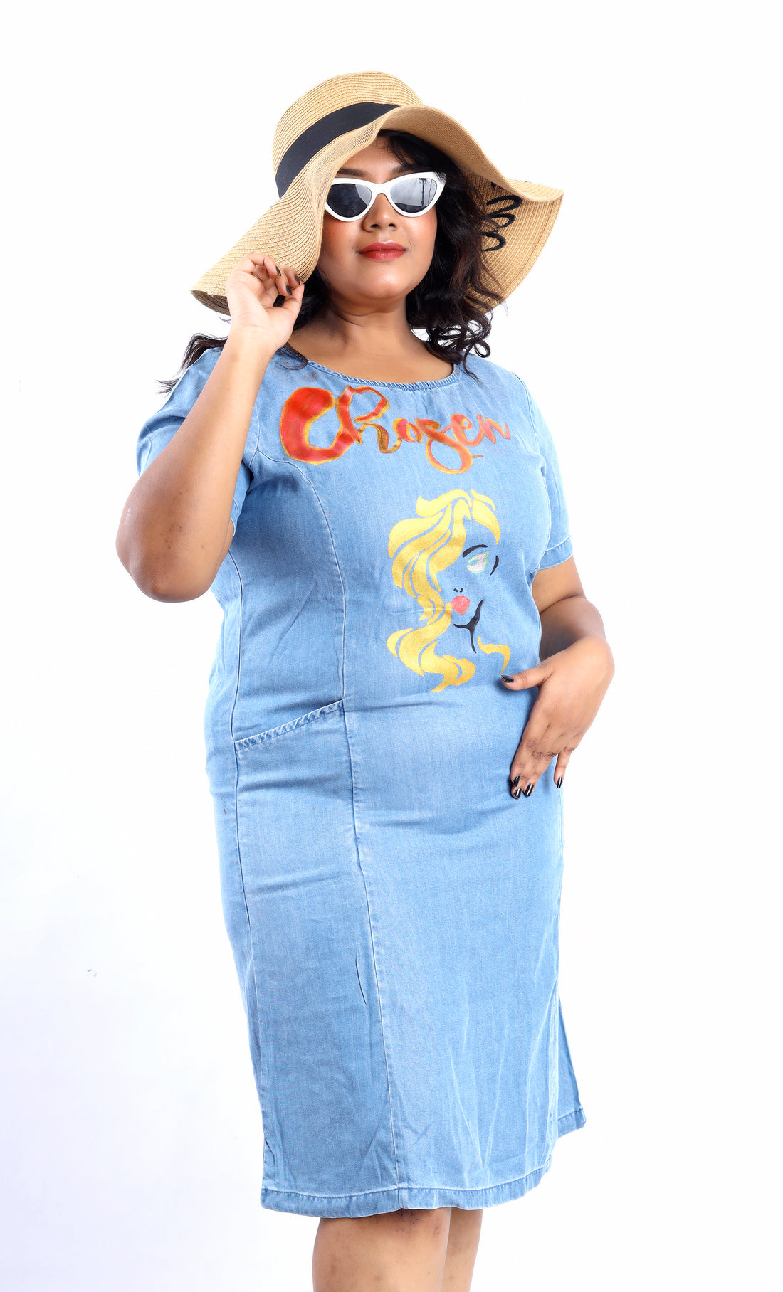 Gotamoda plus size denim dress with colorful graphic design worn with hat and sunglasses