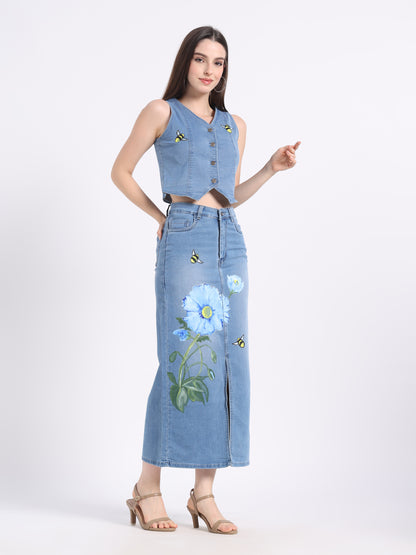 Stylish model wearing a hand-painted denim co-ord set featuring floral designs on a crop top and skirt