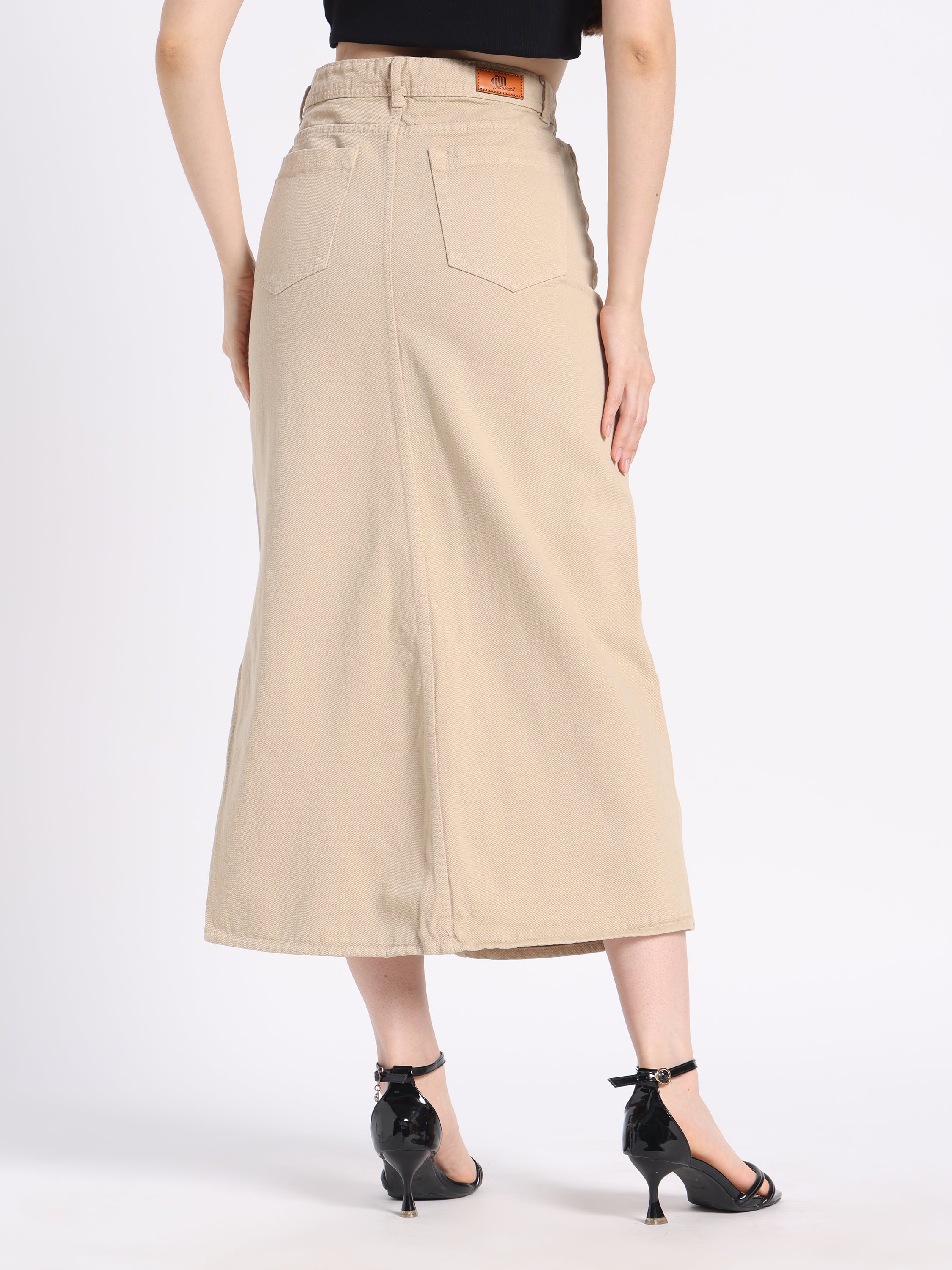 Back view of a gotamoda hand-painted denim skirt in beige with a long silhouette