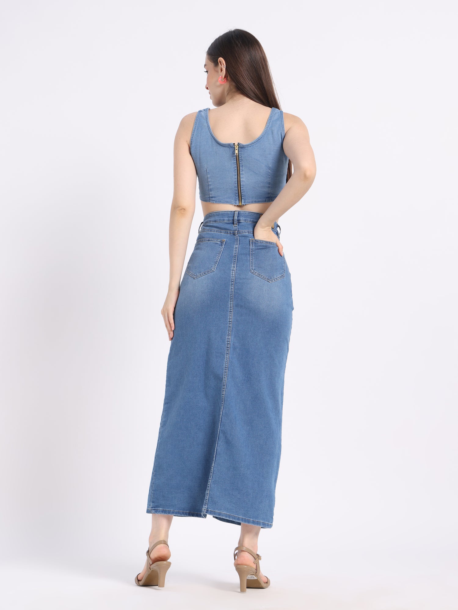 Back view of hand-painted floral denim co-ord set featuring a crop top and long skirt