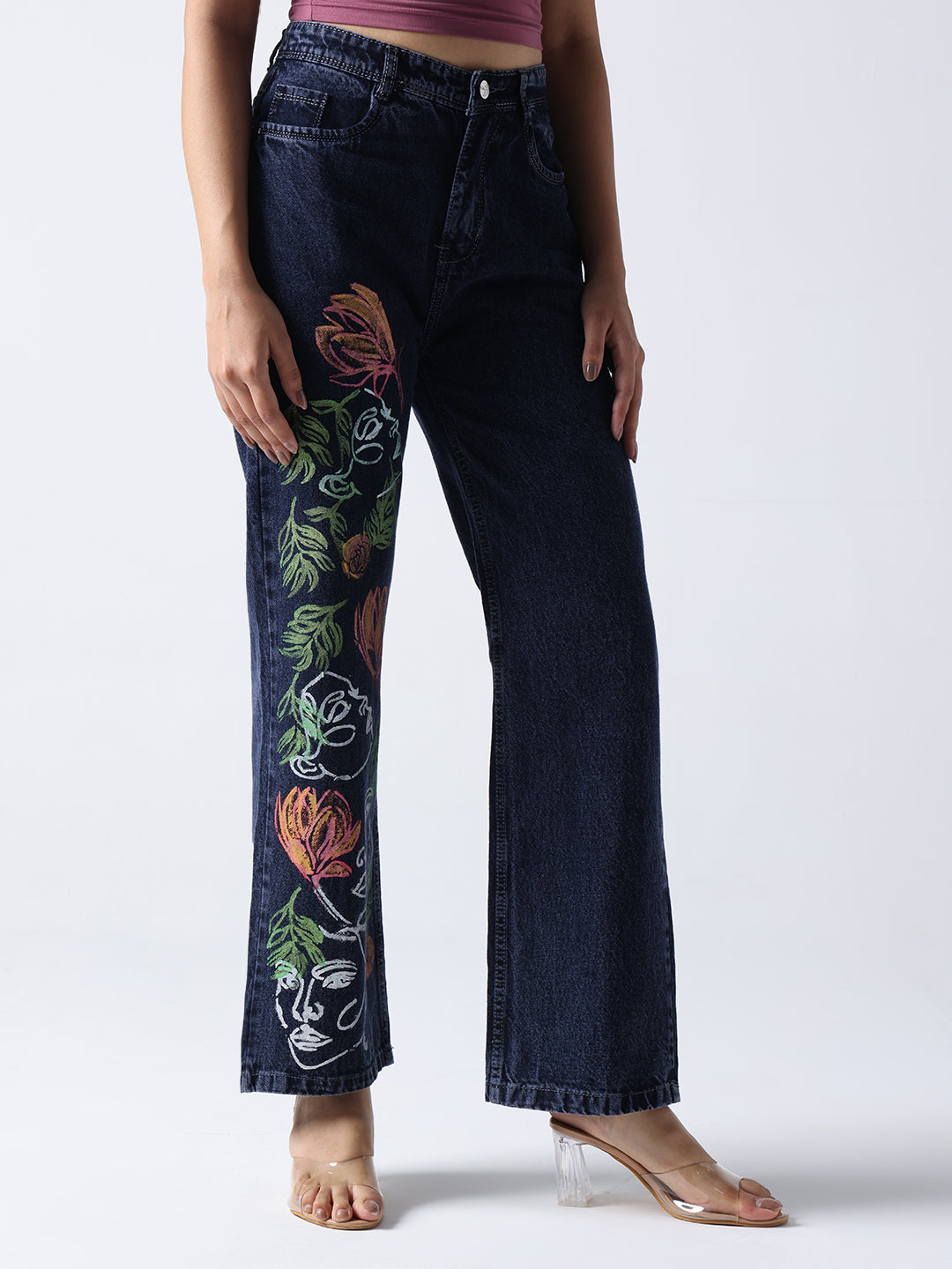 Gotamoda hand painted jeans in dark denim with colorful floral and face art design on one leg