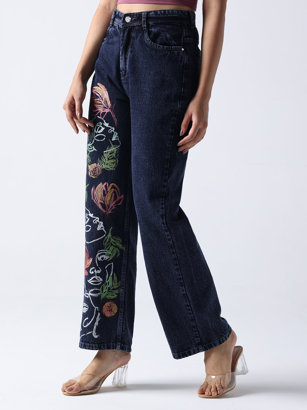 Gotamoda dark blue hand painted jeans with floral and abstract face designs on one leg