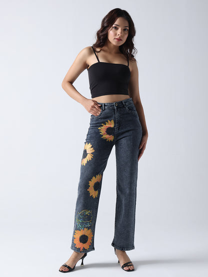 Gotamoda hand painted jeans with sunflower design worn with black crop top and heels