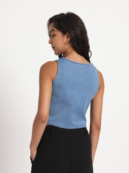 Gotamoda sleeveless blue jeans top worn by woman paired with black pants