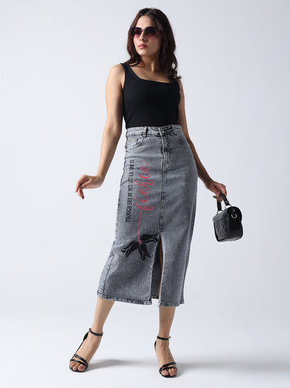 Poetic rose hand Painted denim skirt by Gotamoda with front slit worn with black tank top and sunglasses
