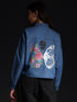 Gotamoda top jeans shirt with floral and butterfly print on the back, worn by model from behind