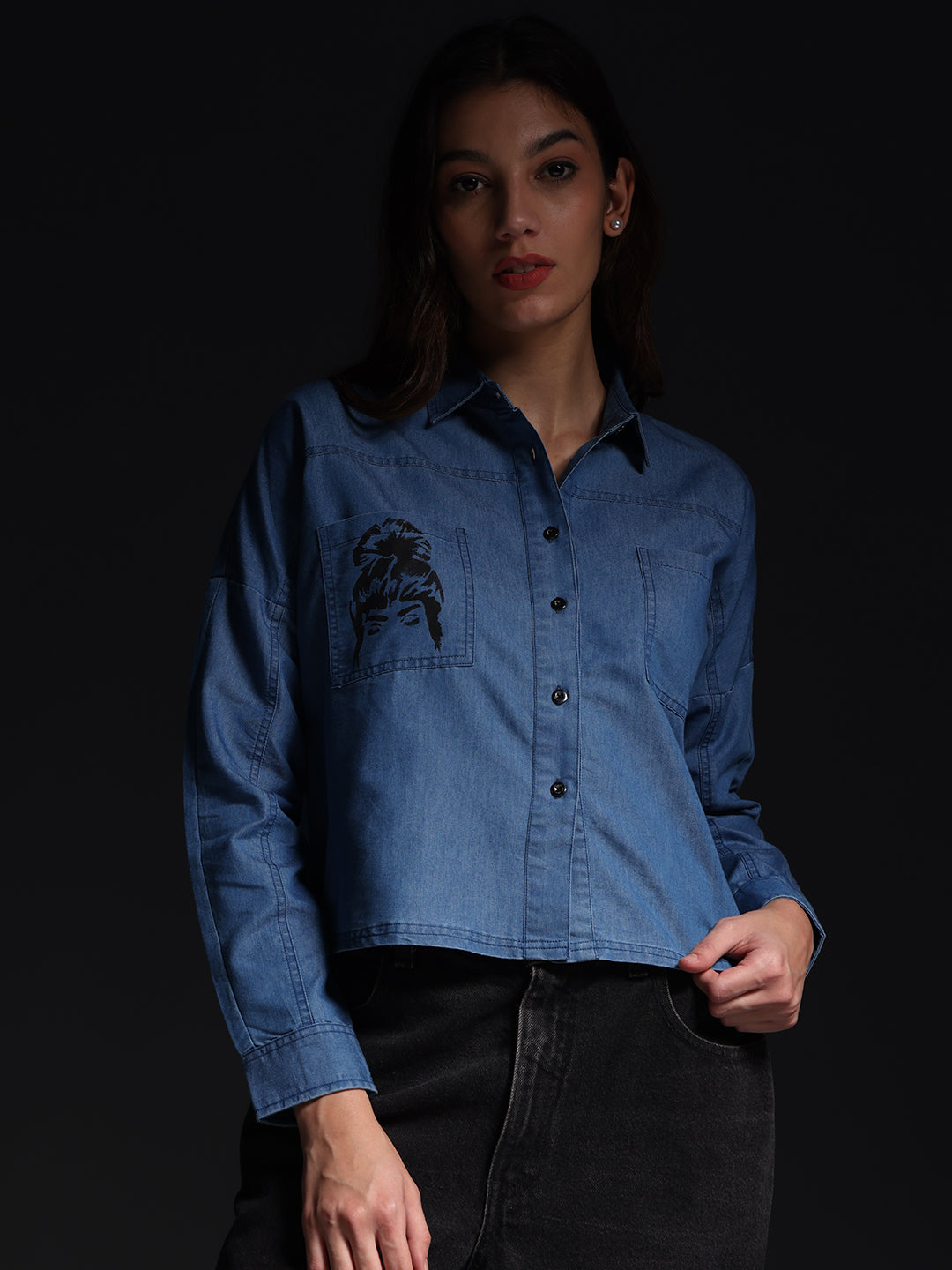 Gotamoda top jeans shirt in blue denim with front pocket and long sleeves worn by a woman