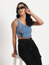 Gotamoda crop jeans top in blue denim worn by woman with black jeans and sunglasses