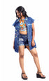Gotamoda sleeveless denim jacket with embroidered floral details worn over colorful crop top and denim shorts