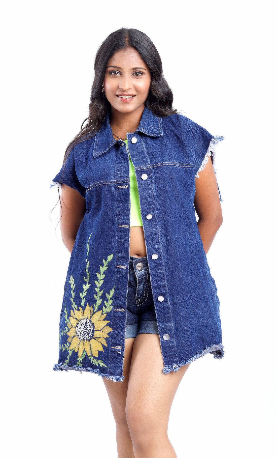 Gotamoda sleeveless denim jacket with sunflower embroidery worn by woman over casual outfit