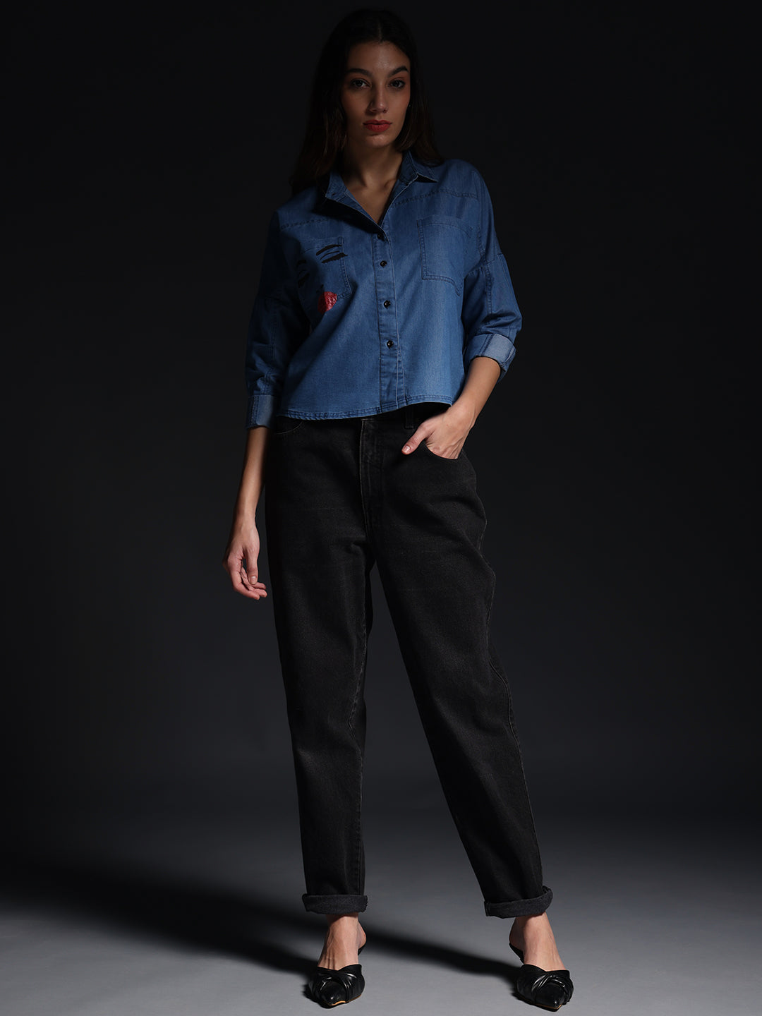 Gotamoda woman wearing a blue top jeans shirt paired with black rolled-up pants and black flats