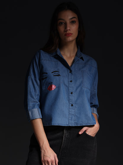Gotamoda top jeans shirt with button-down front and embroidered face design on denim fabric