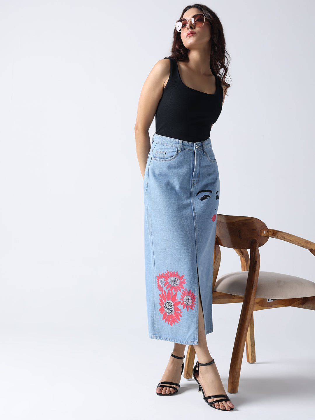 Winking Beauty Denim Hand Painted Denim Skirt worn by model with black top and sandals
