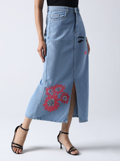 Winking Beauty Denim Hand Painted Denim Skirt with red floral and face design, front slit, styled with black strappy heels